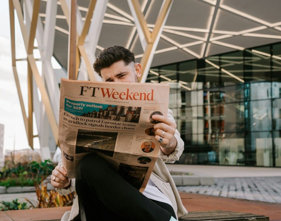 A man reading a newspaper.